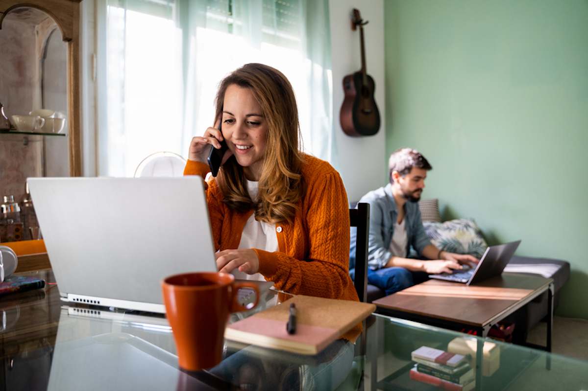 Happy young couple working from home